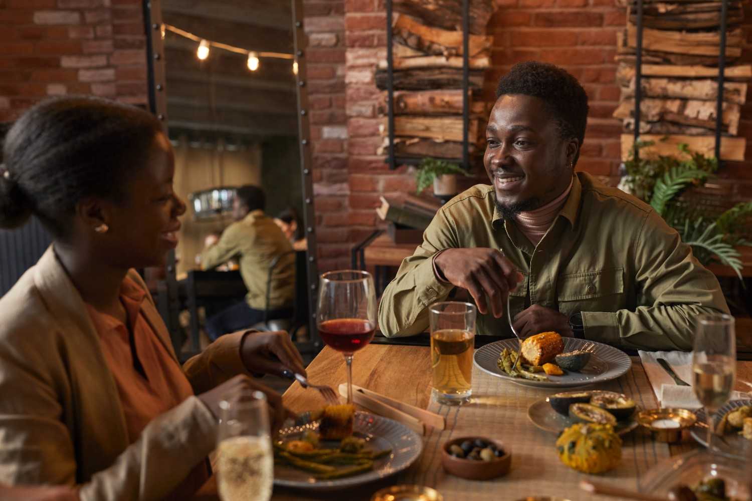 Friends enjoying food together around a table